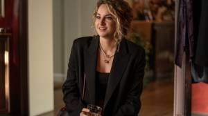 Shailene Woodley in 'Three Women,' a new series where she plays Gia, based on author Lisa Taddeo, shown here sitting with a cocktail, wearing a black suit jacket