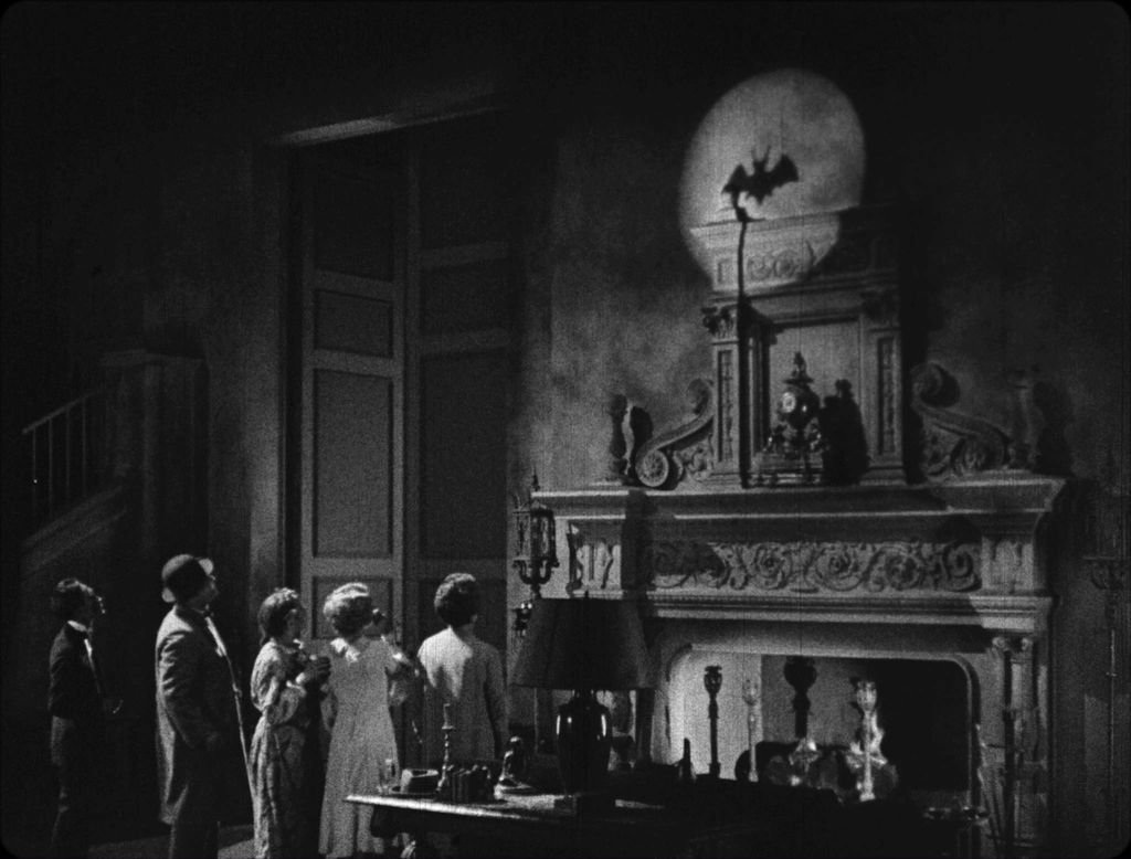 The inhabitants of a creepy old mansion get a clue that the master criminal known as The Bat may be nearby in this scene from Roland West's THE BAT (1926).