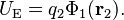 U_\mathrm{E} = q_2 \Phi_1(\mathbf r_2).