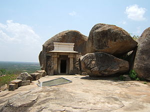 Entrance to cave dug into a rock