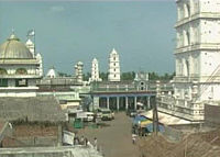 twin minarets with two minarets in the background