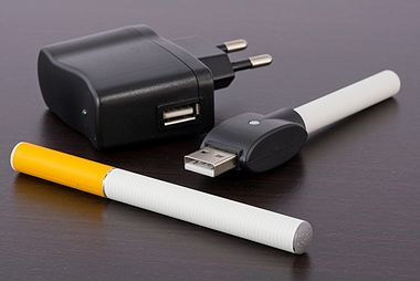 An electronic cigarette with a USB-powered charger and wall changer.