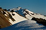 Partially snow-covered Old Snowy Mountain.