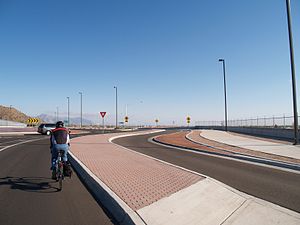 Cyclist rides through main lane of roundabout