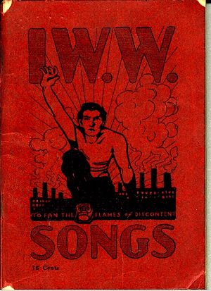 Booklet cover with large title, "IWW Songs", and illustration of a man climbing over a hill, reaching skyward, with factories in the background.