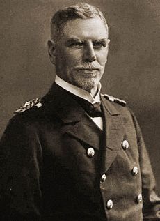 A older man in a double-breasted naval uniform