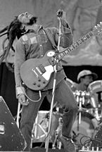 Bob Marley playing guitar