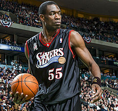 Dikembe Mutombo speaking to the press