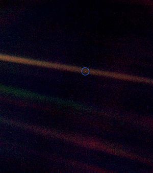 Pale blue dot image with a wider field of view to show more background