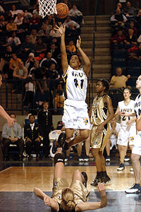 Navy Midshipmen Nikki Curtis gets a shot off over an Army West Point cadet