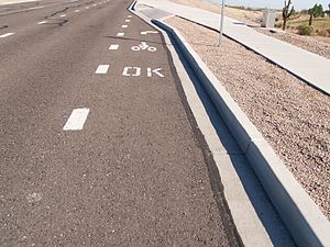 Pavement markings indicate sidewalk riding is legal.