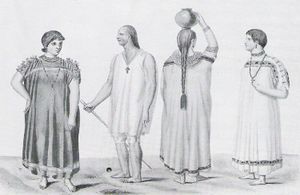 Two men and two women. The men wear necklaces with crosses around their necks. One of the women wears a necklace the other shown from the back has braided hair. Three of them wear wide robes, the third wears a shirt and kneelength trousers.