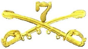 A computer generated reproduction of the insignia of the Union Army 7th Regiment of Cavalry. The insignia is displayed in gold and consists of two sheafed swords crossing over each other at a 45 degree angle pointing upwards with a Roman numeral 7