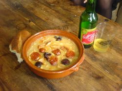 Fabada Asturiana, typically served with crusty bread and Asturian cider