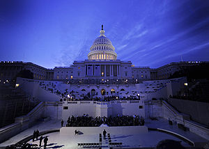 U.S. Capitol at dusk, mostly darkened but with dome floodlit from within