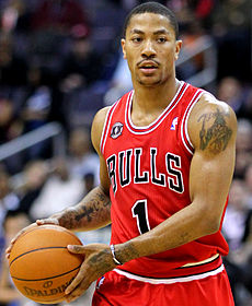 Derrick Rose holds a basketball