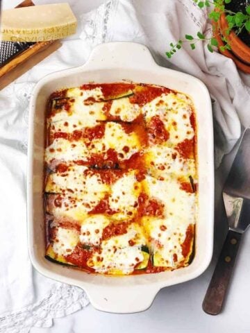 Italian baked zucchini in pan on a table.