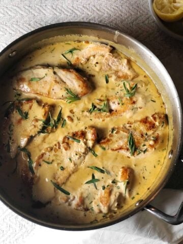 chicken tarragon in pan with sauce