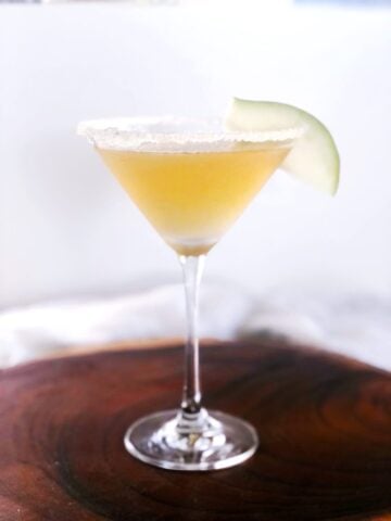 pear martini in martini glass with a pear slice garnish