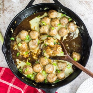 Overhead view of meatballs in the skillet.