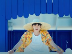 BTS’ Jin Hits the Beach in Video for Full Version of ‘Super Tuna’