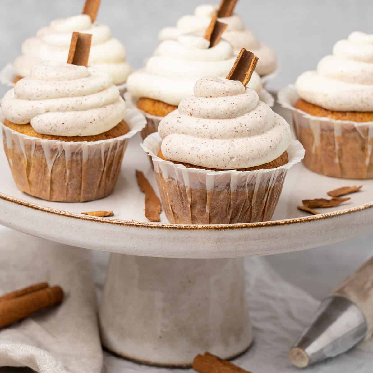 Cinnamon cupcakes on a cake stand.