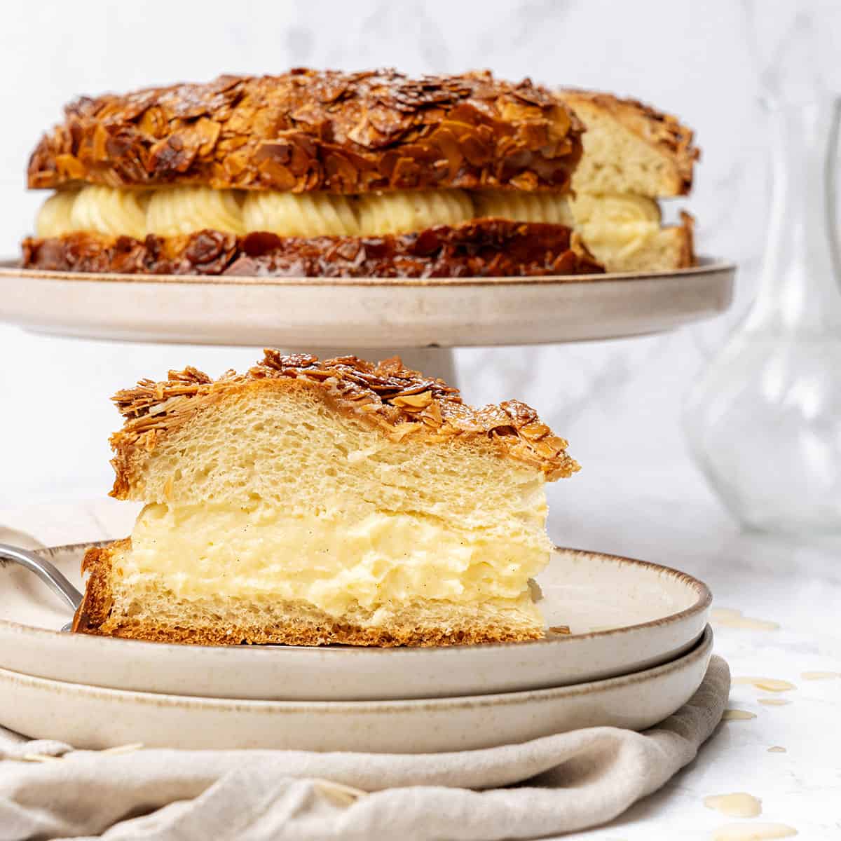 a slice of german bee sting cake on a plate.