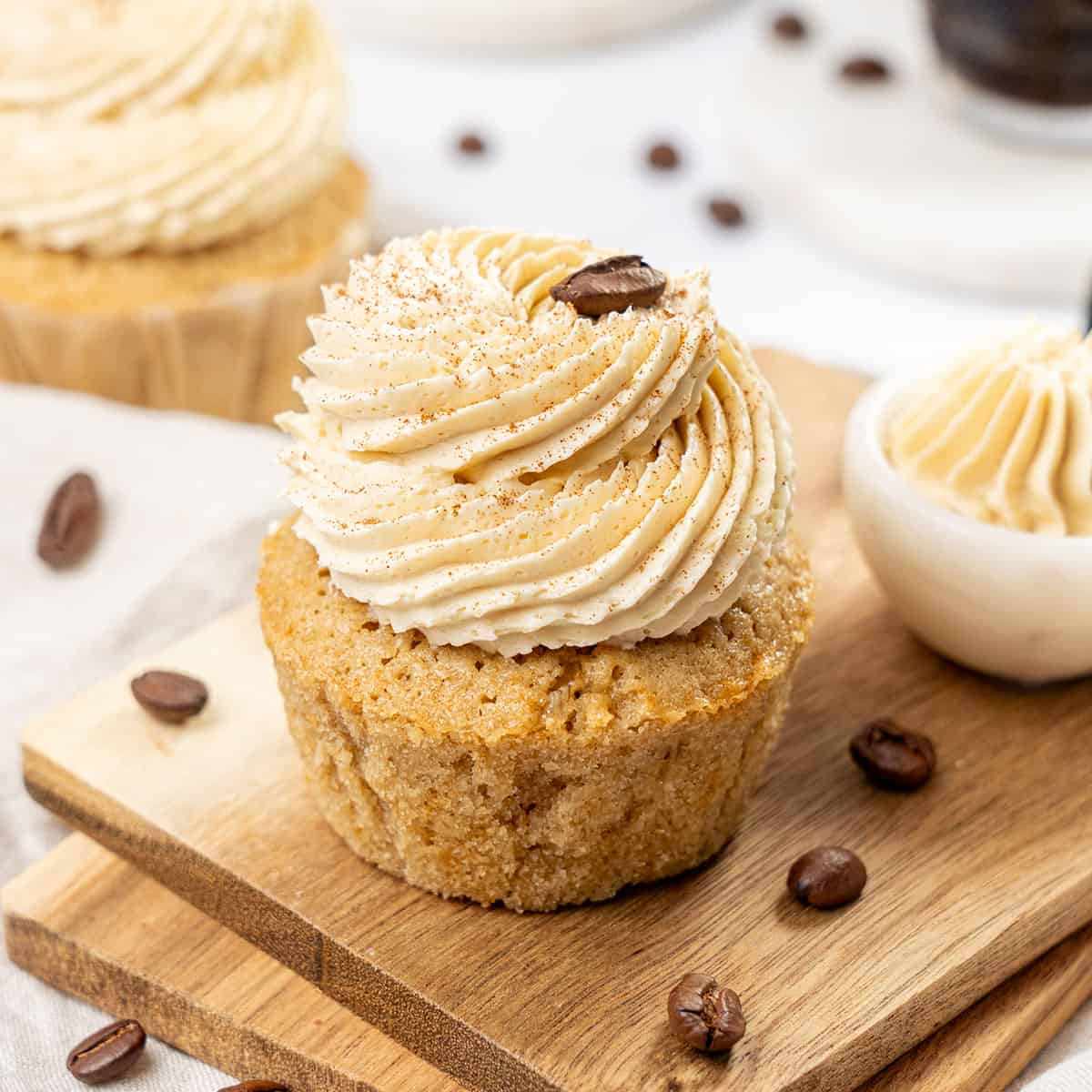 Coffee cupcakes on a cutting board.