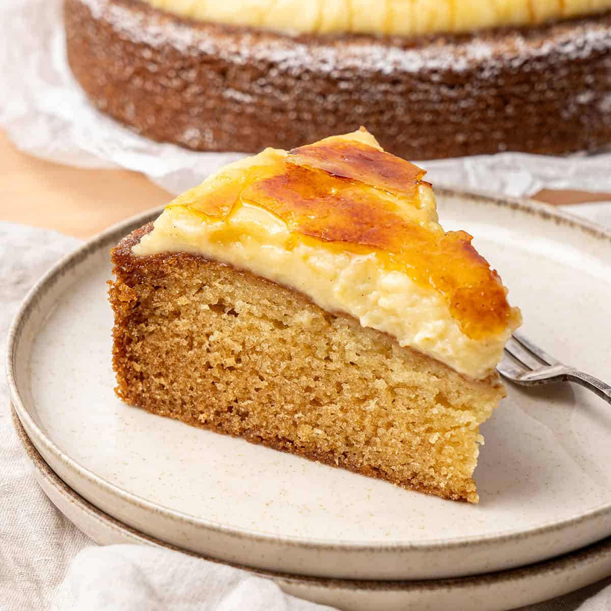 a slice of creme brulee cake on a plate.