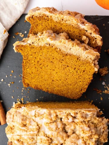 a slice of Pumpkin streusel bread o na cutting board.