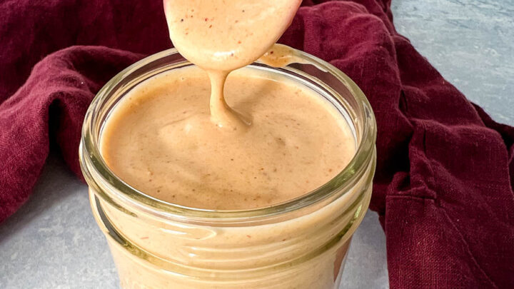 a spoonful of southwest salad dressing in a glass jar