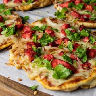 Personal sized pizza on a cutting board