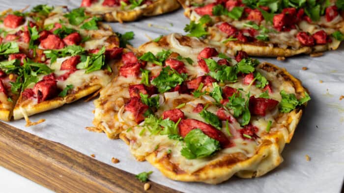 Personal sized pizza on a cutting board