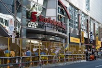 People protest outside of Scotiabank Theatre about the documentary "Russians at War" playing at the Toronto International Film Festival, in Toronto, on Tuesday Sept. 10, 2024. THE CANADIAN PRESS/Paige Taylor White