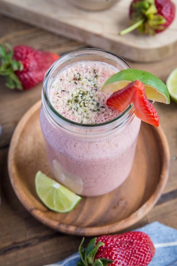 Strawberry Protein Smoothie - packed with plant-based protein, cauliflower, almond milk, yogurt, almond butter, dates and lime juice, this healthy banana-free smoothie is a perfect post-workout meal in a glass