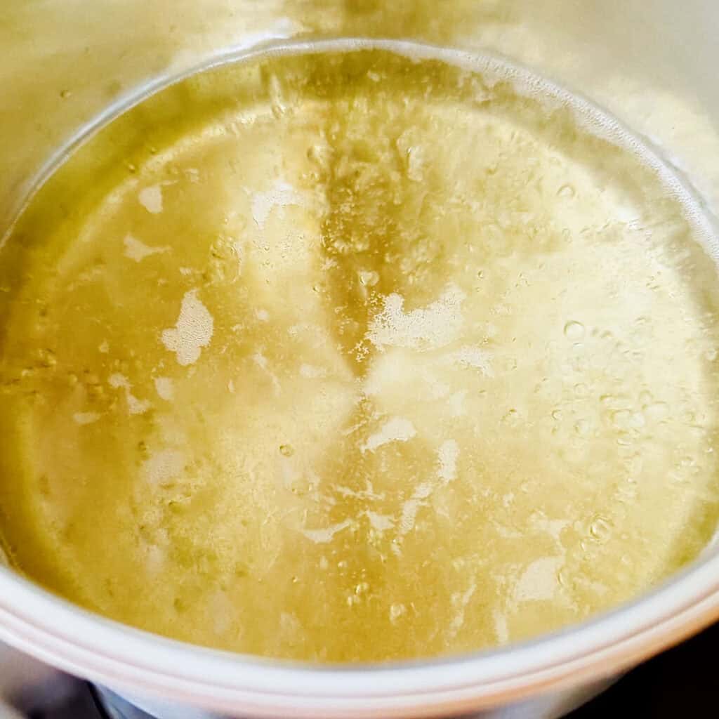 Boiling off the alcohol in the base sauce.